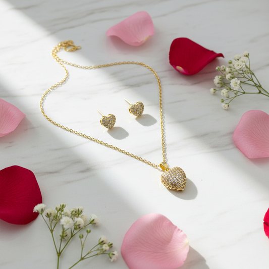 Heart jewelry set on marble with roses at angle