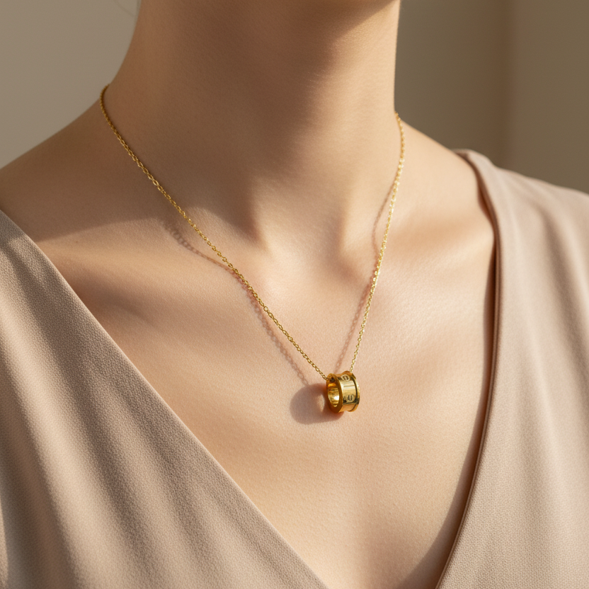 Model wearing luxury cylindrical pendant necklace