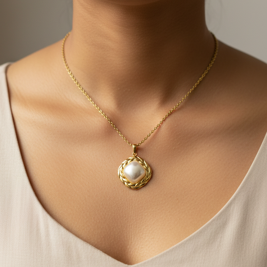 Indian woman wearing pearl pendant - shoulders closeup