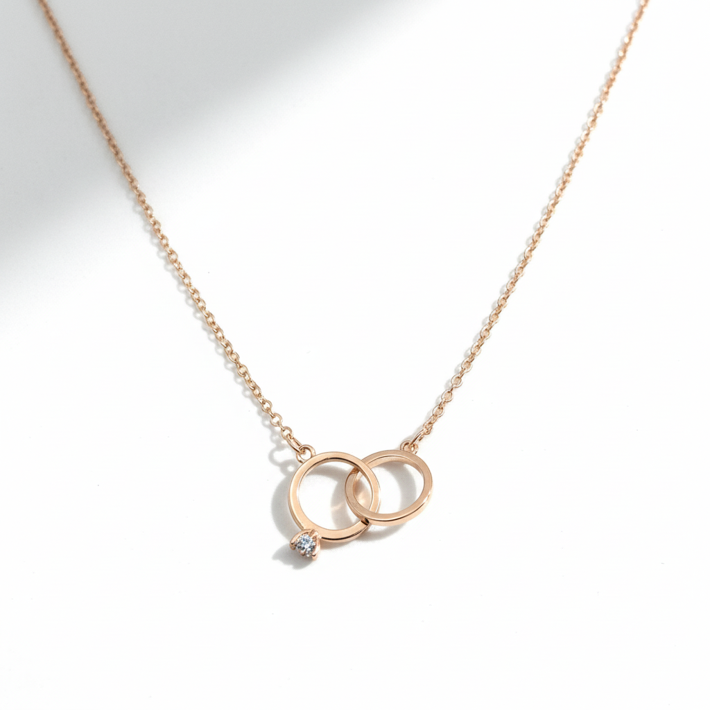 Interlocking rings pendant on white background