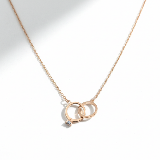 Interlocking rings pendant on white background