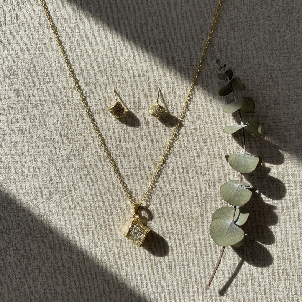 Jewelry set on beige linen with eucalyptus
