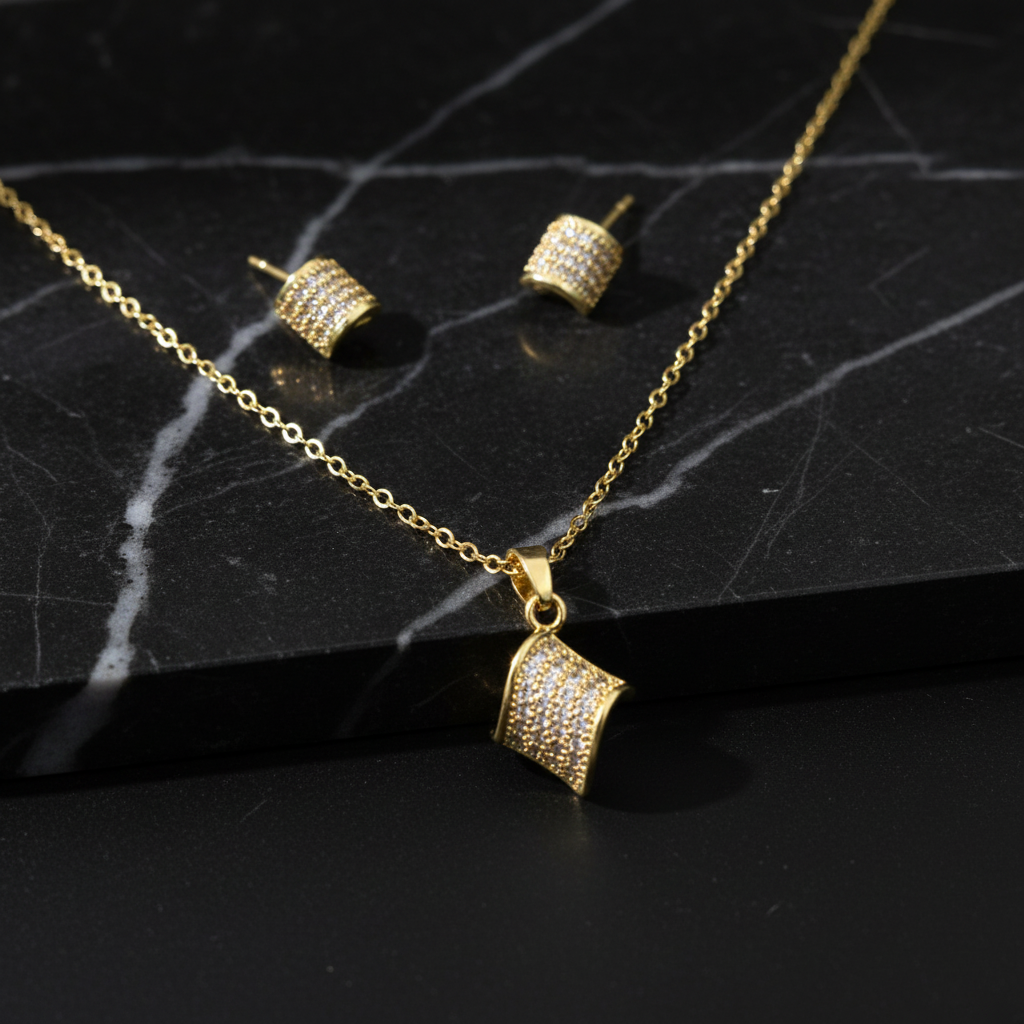 Jewelry set on black marble with dramatic lighting