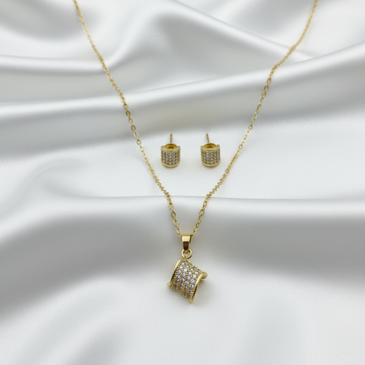 Jewelry set on white silk with high-key lighting