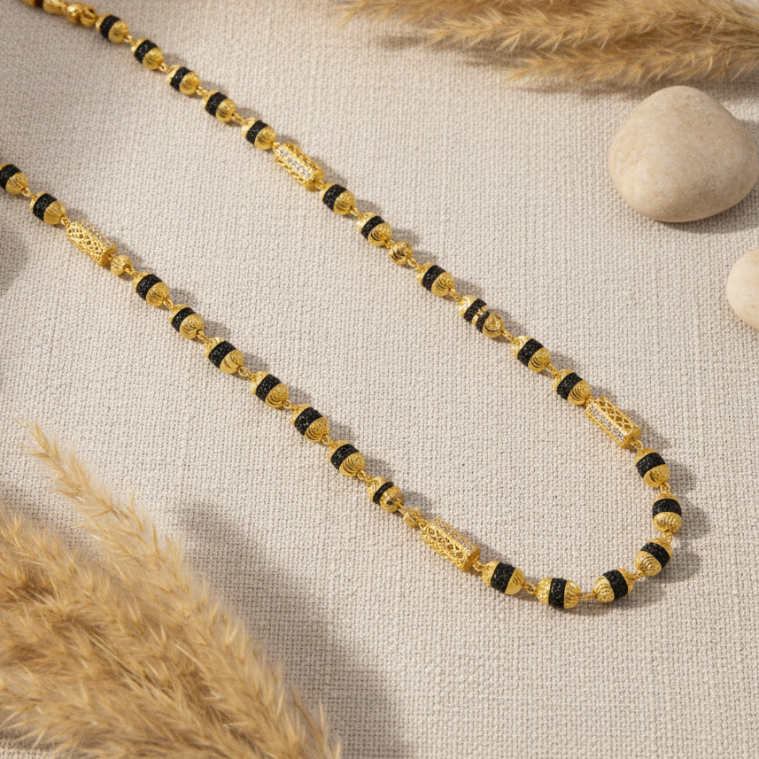 Mala on beige linen with pampas grass